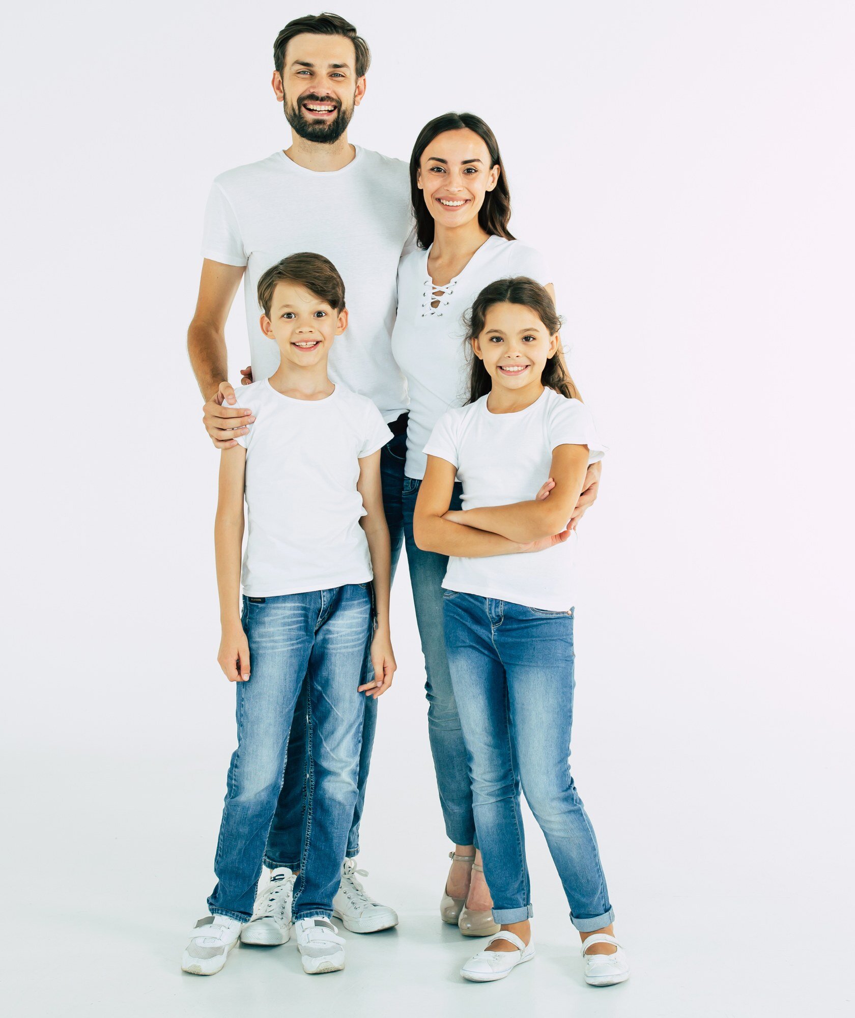 Family of four smiling together - convenient orthodontic care for Edgewater families