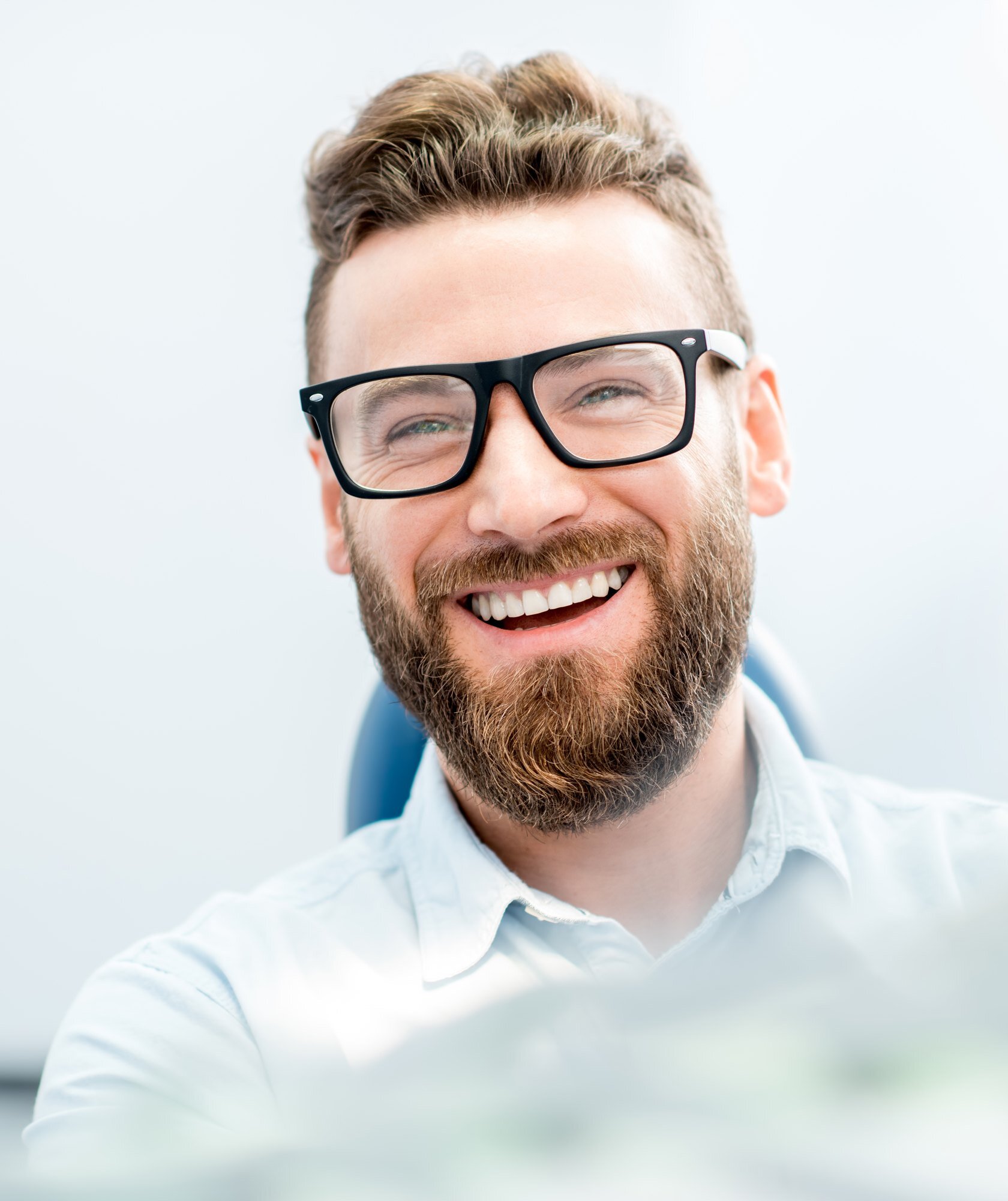 Smiling adult patient during a friendly orthodontic consultation
