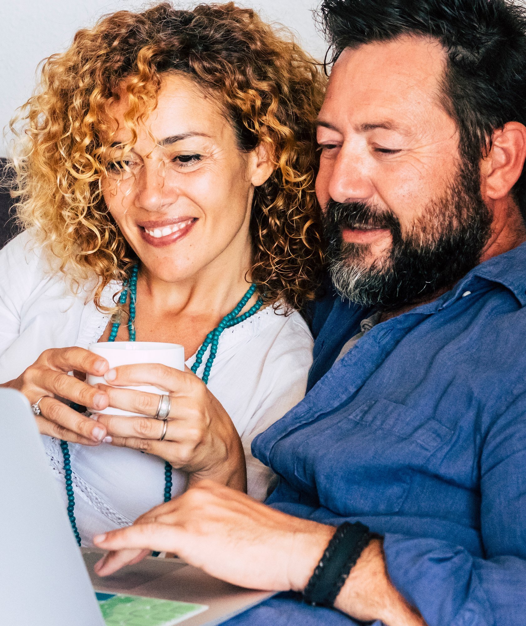 Couple reviewing their dental insurance benefits on a laptop at home